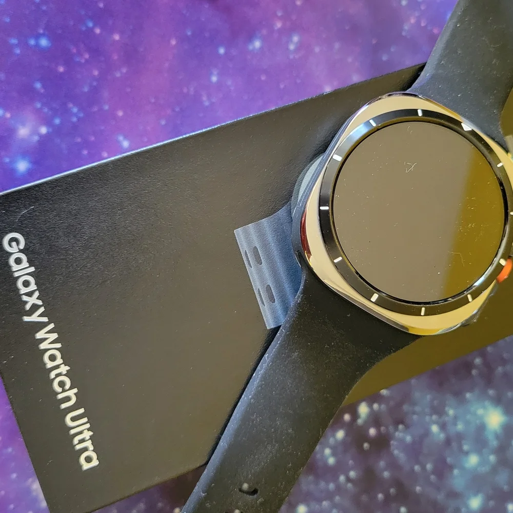 Samsung Smartwatch with Black Strap and Gold Bezel